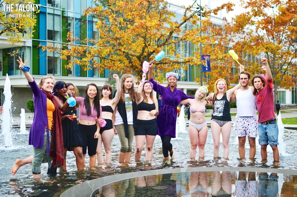 Bathing Babes: students bathe in the fountain to protest tuition and housing fee increases.