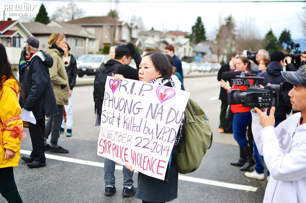 Attendees briefly blocked traffic before being asked to stop by an organizer.