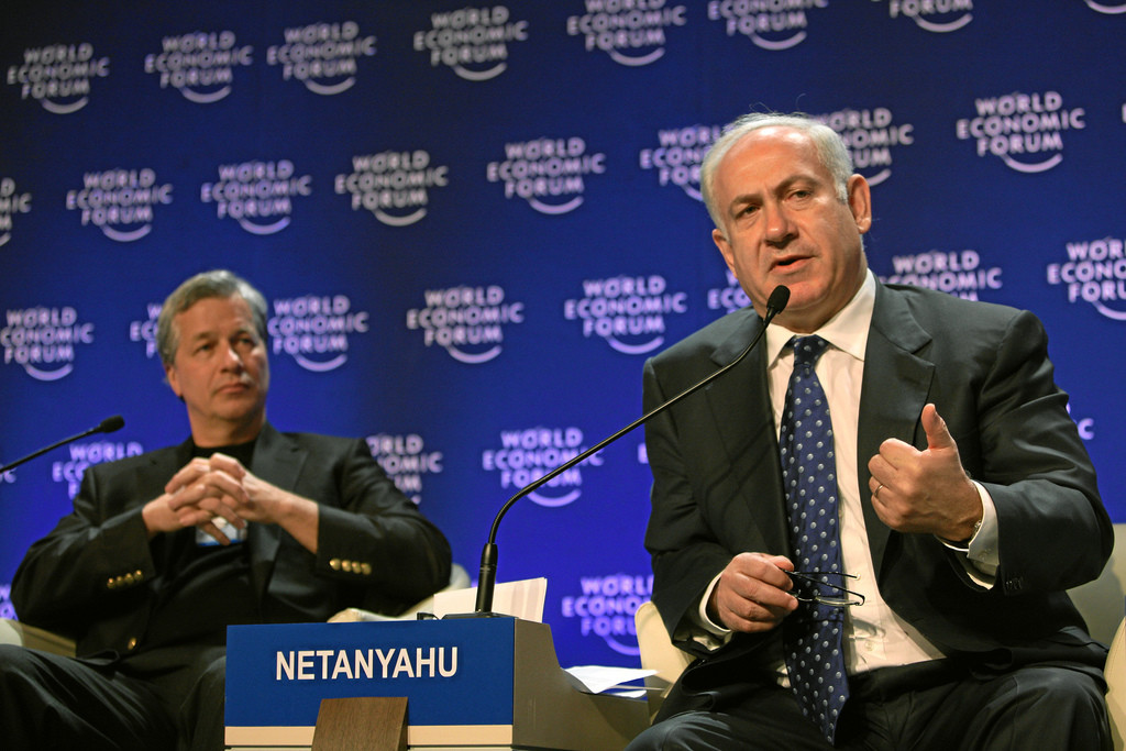 A narrow focus on Israel can lead to progressive activists targeting Jewish liberation and nationalism while missing the broader Western forces of oppression that have become embedded in Israeli state actions. Here, JP Morgan Chase CEO James Dimon looks on as Israeli prime minister speaks at the 2009 World Economic Forum. Photo: WEF/Creative Commons License